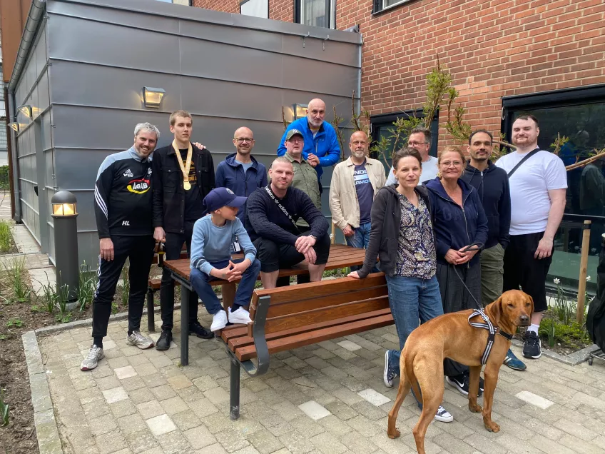 Members of Med-service's staff gathered at BMC for barbecue. In front a Rhodesian Ridgeback, photo. Photo: Anna Hellgren